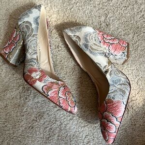Nine West floral print block heel pumps.